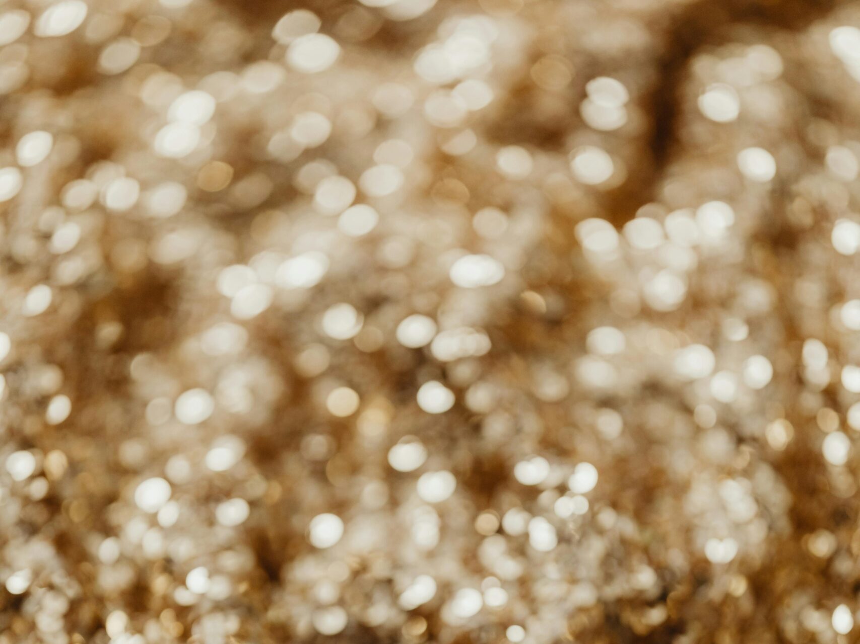 Captivating close-up of shimmering gold sequins, perfect for fashion and design projects.